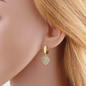 Elegant gold-plated heart drop earrings with shimmering zircon pavé stones worn by model