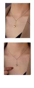Detailed view of an S925 silver vintage heart pendant necklace on a model