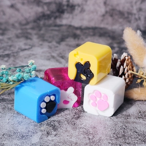 Detailed view of colorful 3D cat paw and heart resin keycaps for DIY crafts