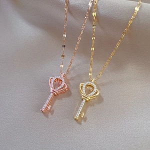 Elegant rose gold and gold crown key pendant necklaces with sparkling crystals