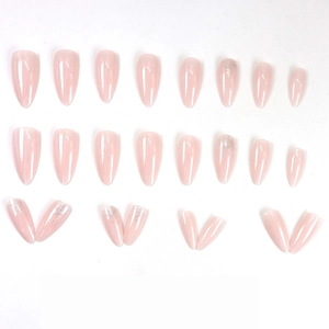 Nude pink almond press-on nails with silver glitter finish for a clean minimalist look