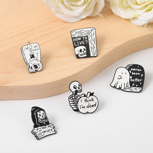 Gothic skull and ghost enamel pins set with sarcastic text on a wooden background