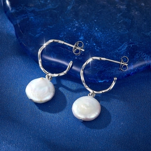 Elegant S925 sterling silver C-shaped stud earrings with baroque white pearls on blue base