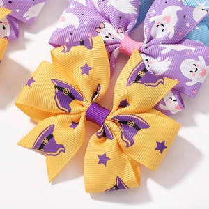 Halloween bat and devil themed yellow bow hair clip with purple witch hat patterns