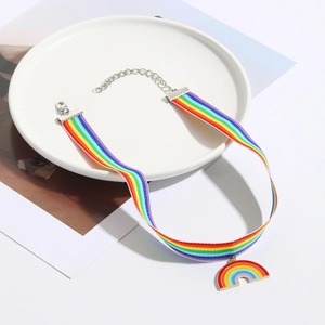 Detail of rainbow ribbon choker with colorful heart enamel pendant and lobster clasp