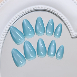 Cat eye press on nails in ice blue with almond shape and velvet shimmering finish