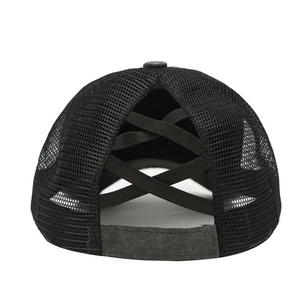 Detail of cross elastic bands for high ponytail on black breathable mesh softball cap