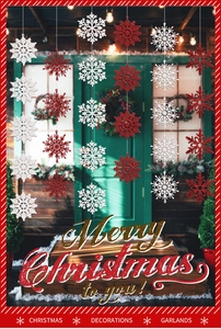 Red and white glitter snowflake garlands hanging on a festive green wooden door