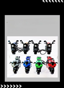 Macro display of diverse colorful motorcycle keychains in cruiser and sport bike styles
