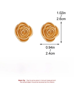 Detailed view of golden rose earrings with 2.6cm x 2.4cm dimensions on a clean white backdrop