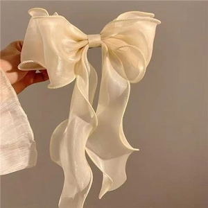 Beige silk bow hair claw clip with elegant ribbon and pearlescent mermaid finish