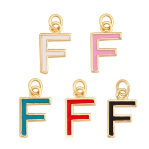 Detailed view of five colorful enamel letter F pendants with golden metal hanging loops