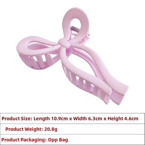 Pink bow hair claw clip showing precise dimensions 10.9x6.3x4.6cm for accessory fit