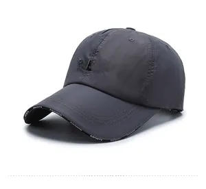 Detail of dark grey breathable sports cap with 3D SPORT embroidery and white brim pattern