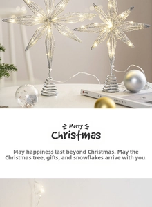 Detail of silver wire Christmas star tree topper with warm white LED glowing lights