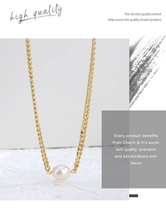 Detailed close-up of a round pink freshwater pearl pendant on a gold Cuban chain