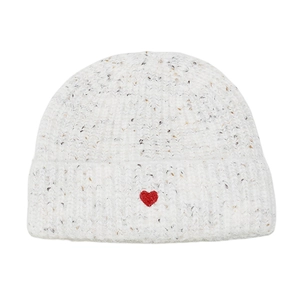 Detail of off-white knitted beanie with colorful nep yarn and red heart embroidery