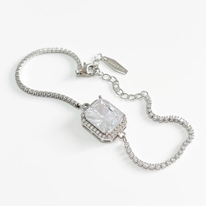 925 silver tennis bracelet featuring a large square zircon centerpiece on white background