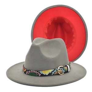 Detail of gray felt jazz hat with red interior and snakeskin band with gold buckle