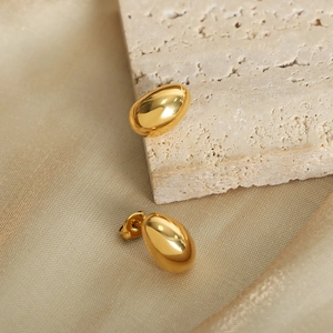 Elegant gold-plated water drop stud earrings with high-polish mirror finish on silk