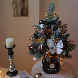 Mini lighted Christmas tree for desk with bows, pinecones and gold ornaments