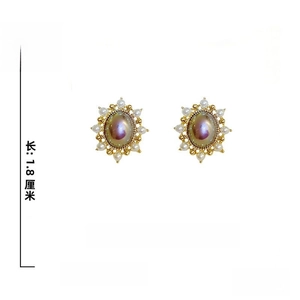Detailed specs showing oval pearls and 925 silver needles on French vintage earrings