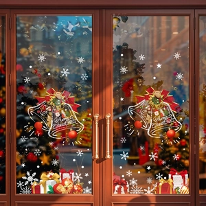 Christmas window stickers with bells, bows and reindeer on a glass door scene