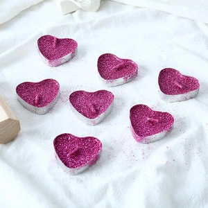 Sparkly rose red heart shaped tea light candles with glitter finish for romantic decor