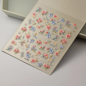 Detailed 5D embossed camellia flower nail stickers with gold accents and floral patterns