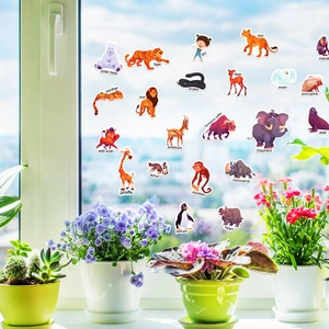 Detail of static animal stickers on a window showing polar bear and tiger for early learning
