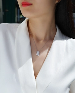 Detailed view of an S925 silver necklace featuring a six-stone rectangular moissanite pendant