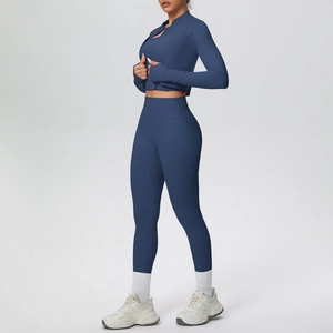 Detail of navy blue yoga set with thumbhole cuffs and high waist compression leggings