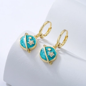 Golden celestial hoop earrings with blue enamel planet charms and zircon star accents