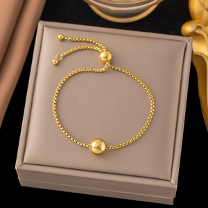 Adjustable 18K gold plated box chain bracelet with spherical charm on jewelry box