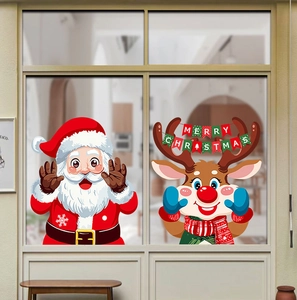 Detailed view of Christmas Santa and reindeer window stickers on smooth glass surface