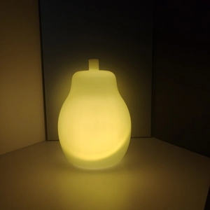 Pear-shaped LED night light with warm yellow glow and frosted texture for Christmas DIY decor