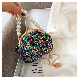 Detail of colorful sequin evening bag with pearl bead handle and gold metal chain strap