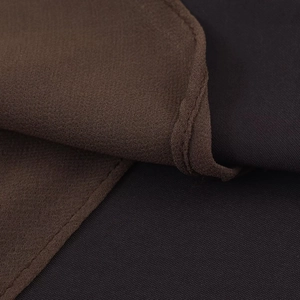 Detail showing high-quality woven texture in coffee and navy blue satin fabric