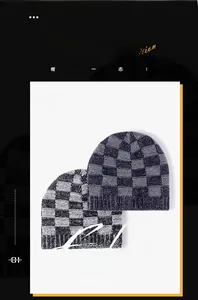 Close-up of jacquard checkerboard pattern on thick knitted thermal beanies with ribbed cuff