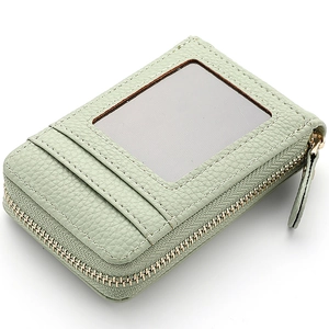 Green leather card holder with zipper closure and transparent ID window