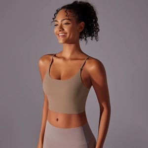 Detail of mocha racerback sports bra with slim straps and seamless high-stretch fabric