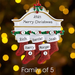 Macro view of 5 stockings fireplace family of five Christmas tree resin ornament