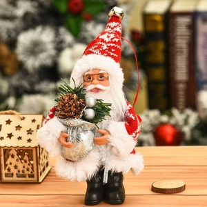 Close-up of a festive Santa Claus figurine with knit textures and mini gift bag