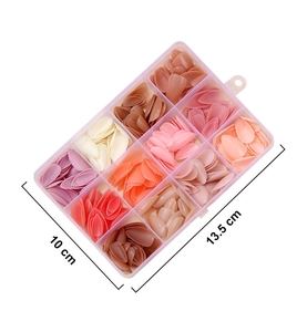 Macro view of 12-color solid press-on nail set in a clear organizer box with size specs