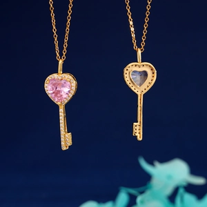 Elegant gold heart key necklaces with pink and blue gemstones and micro-diamond inlay
