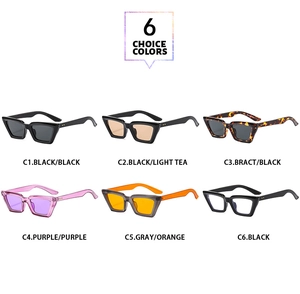 Collezione di sei occhiali da sole cat eye retrò in vari colori su sfondo bianco