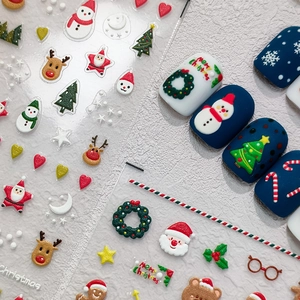 3D embossed Christmas nail stickers featuring Santa Claus, reindeer and festive patterns