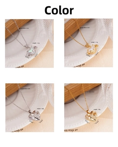 Detail of 18K gold plated heart necklaces with shell inlay and cubic zirconia crystals