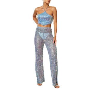 Sparkly light blue sequin two-piece set with halter neck top and sheer straight-leg trousers