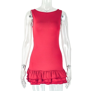 Detail of red sleeveless dress featuring double-layered ruffled hem and slim fit silhouette